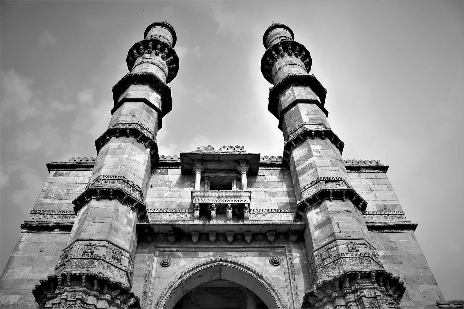 Black and white view of Jama Masjid's architectural minarets in Ahmedabad, India.